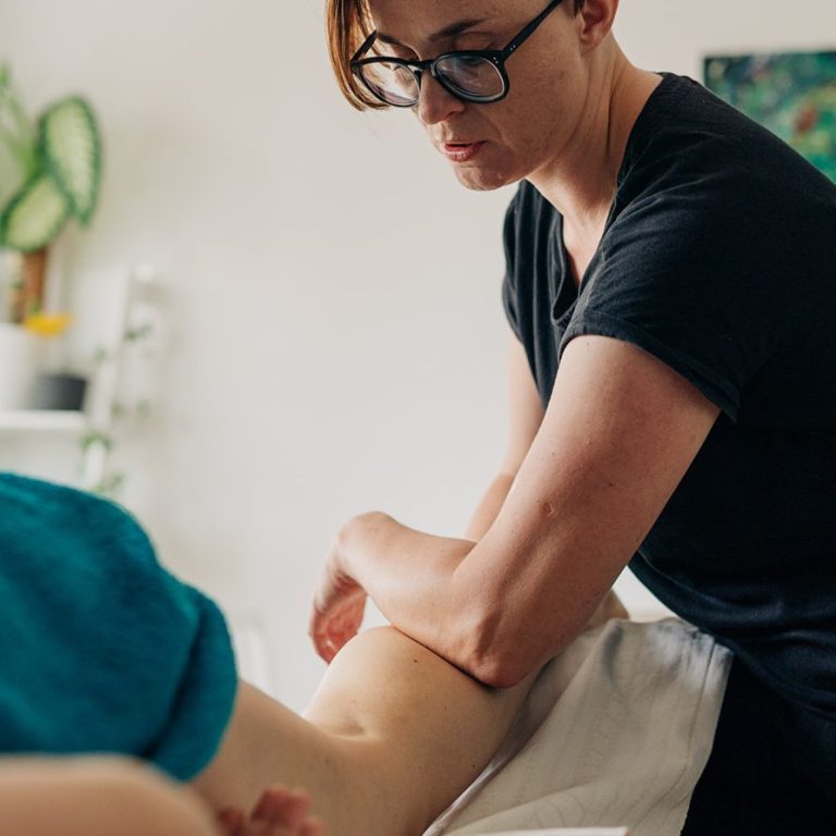 Deep tissue techniques to release muscle tightness in calf Mobile sports deep tissue massage session in a calm home environment, South West London.